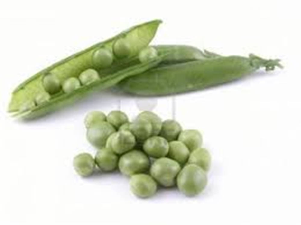 Freshly Picked Sugar Snap Peas On A Wooden Surface. Wallpaper