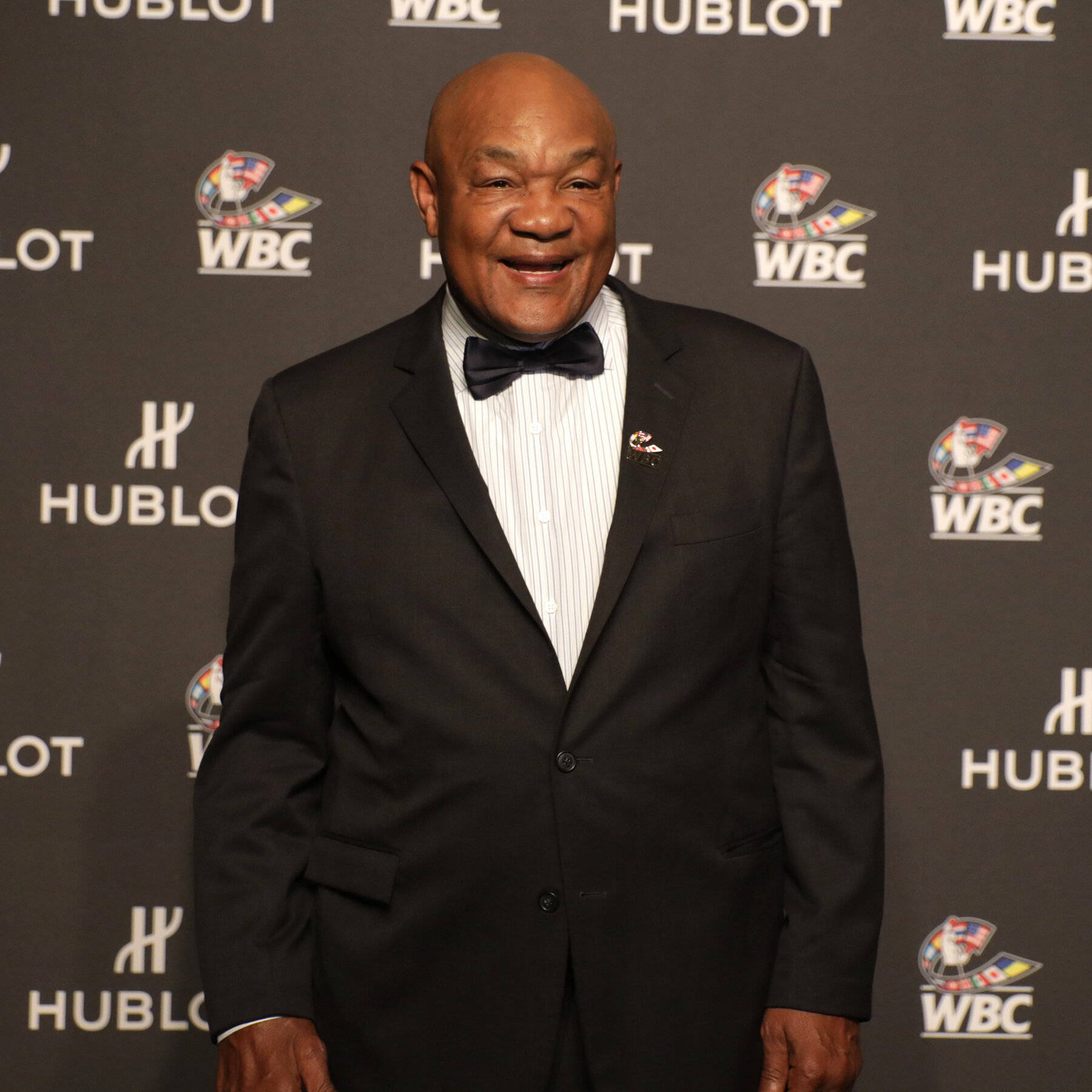 George Foreman Looking Suave In Suit Wallpaper