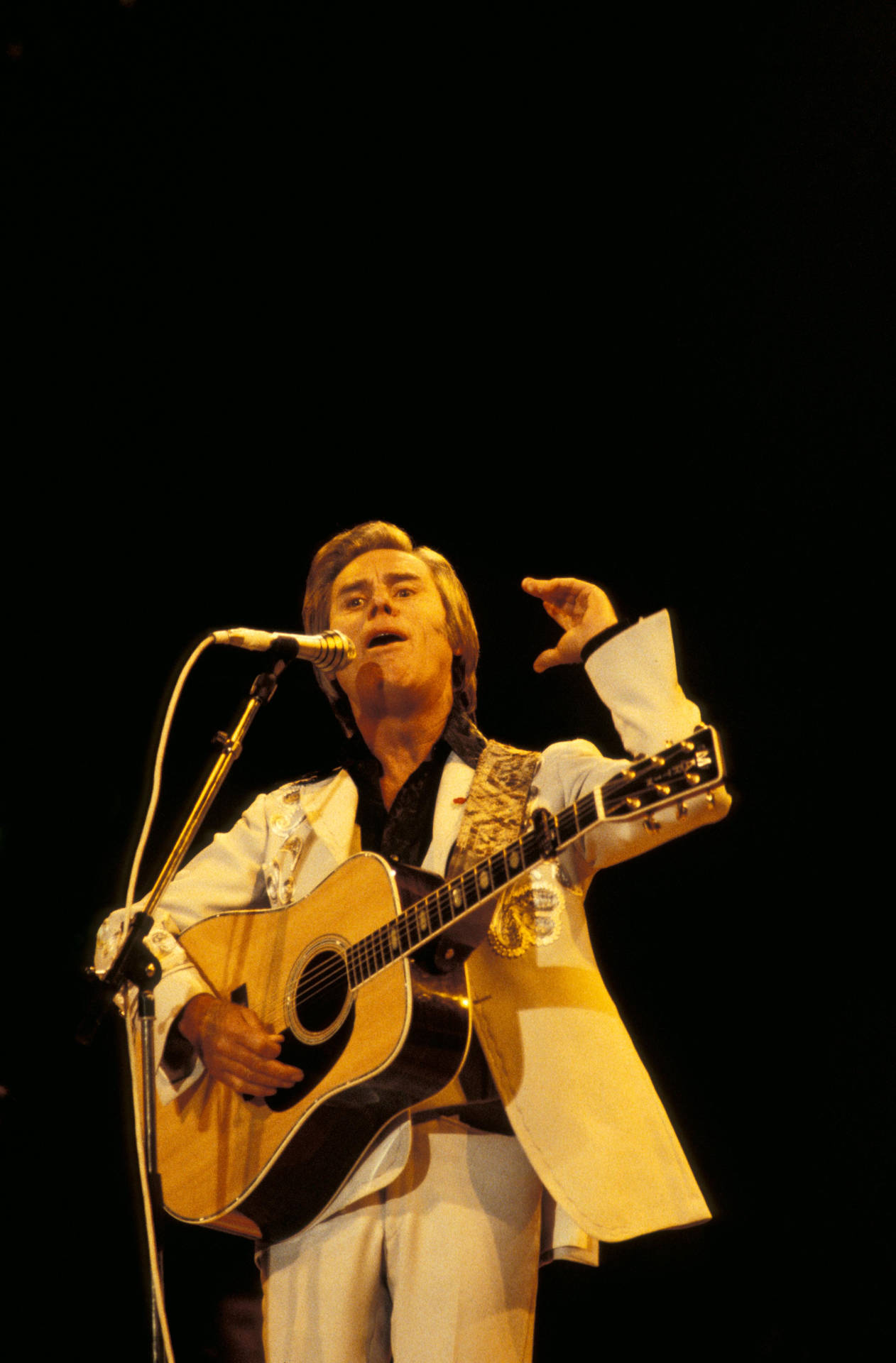 George Jones Passionately Singing In A Live Performance Wallpaper