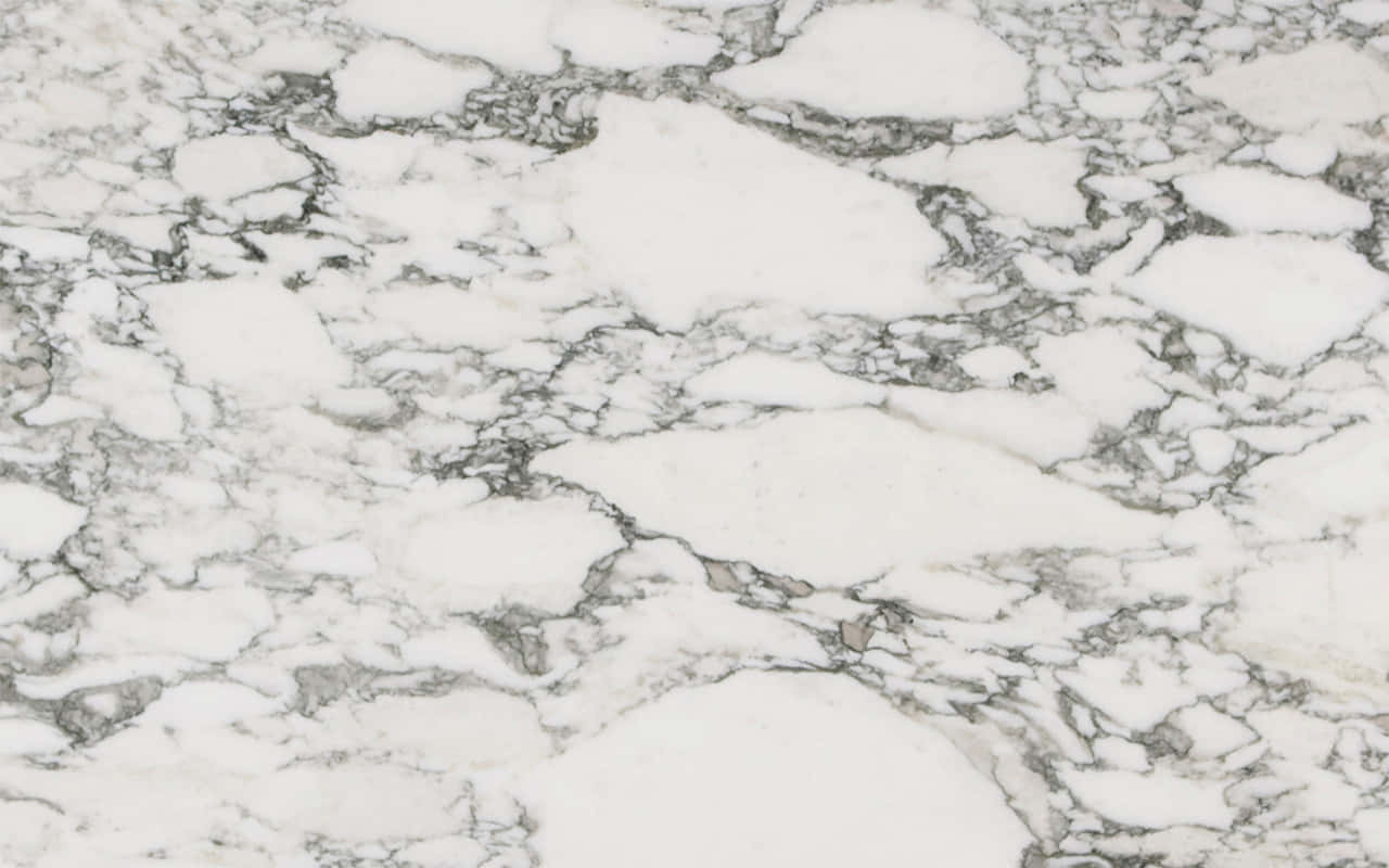 Get A Sleek And Stylish Look With This Timeless Marble Macbook Wallpaper
