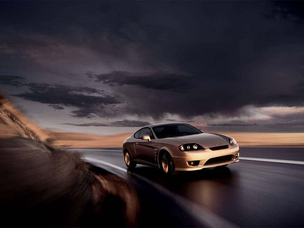 Gold Cars Driving On Cloudy Night Wallpaper