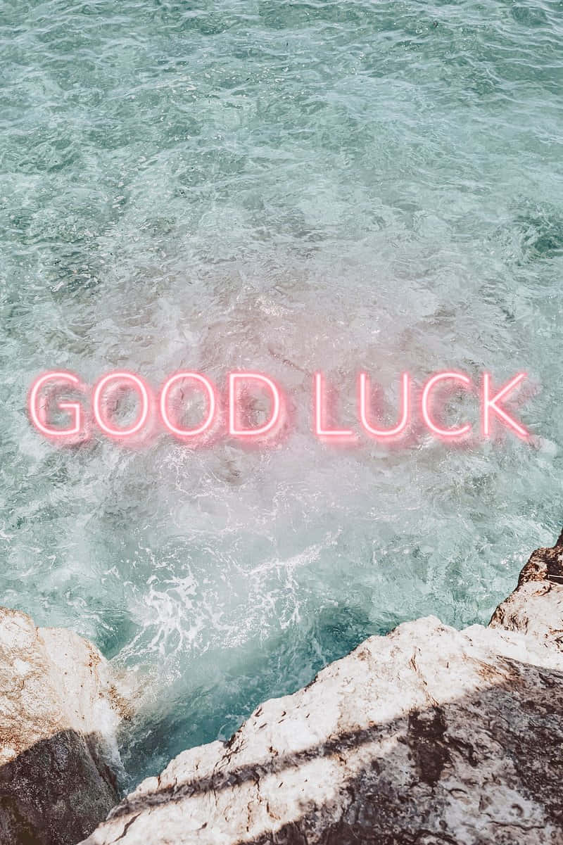 Good Luck Neon Sign Over Water Wallpaper