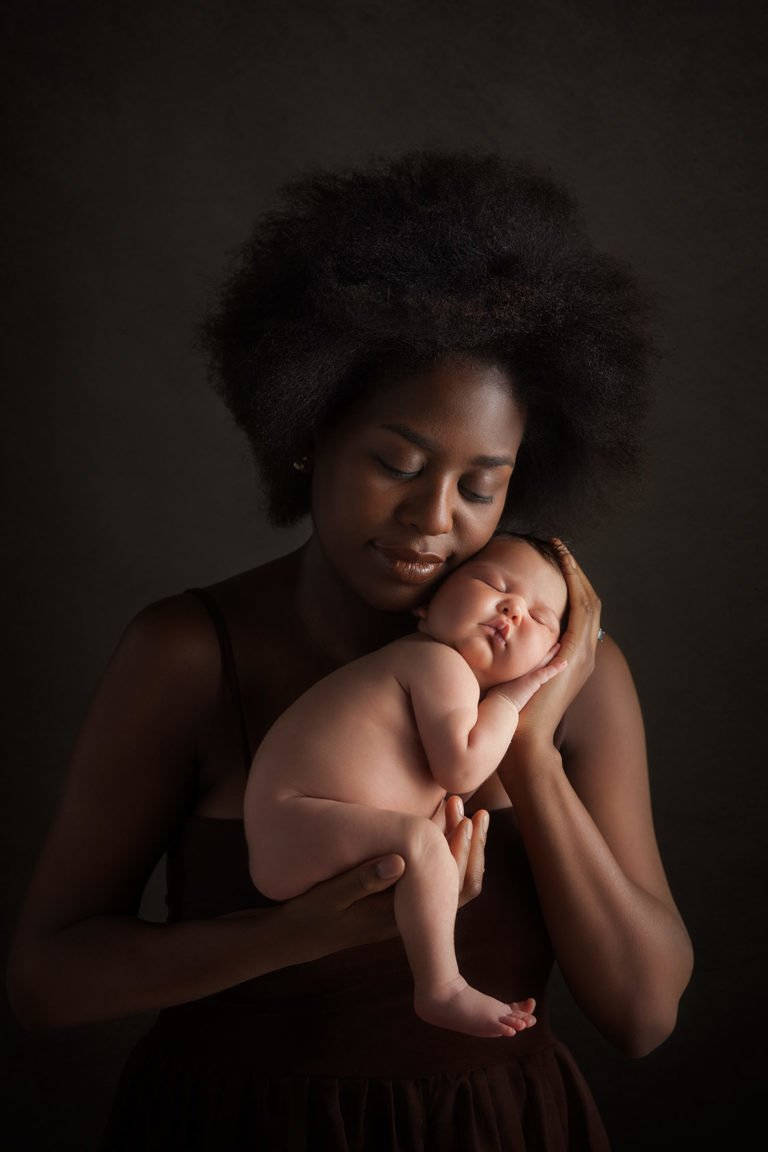 Gracefully Posing Mother And Baby Wallpaper