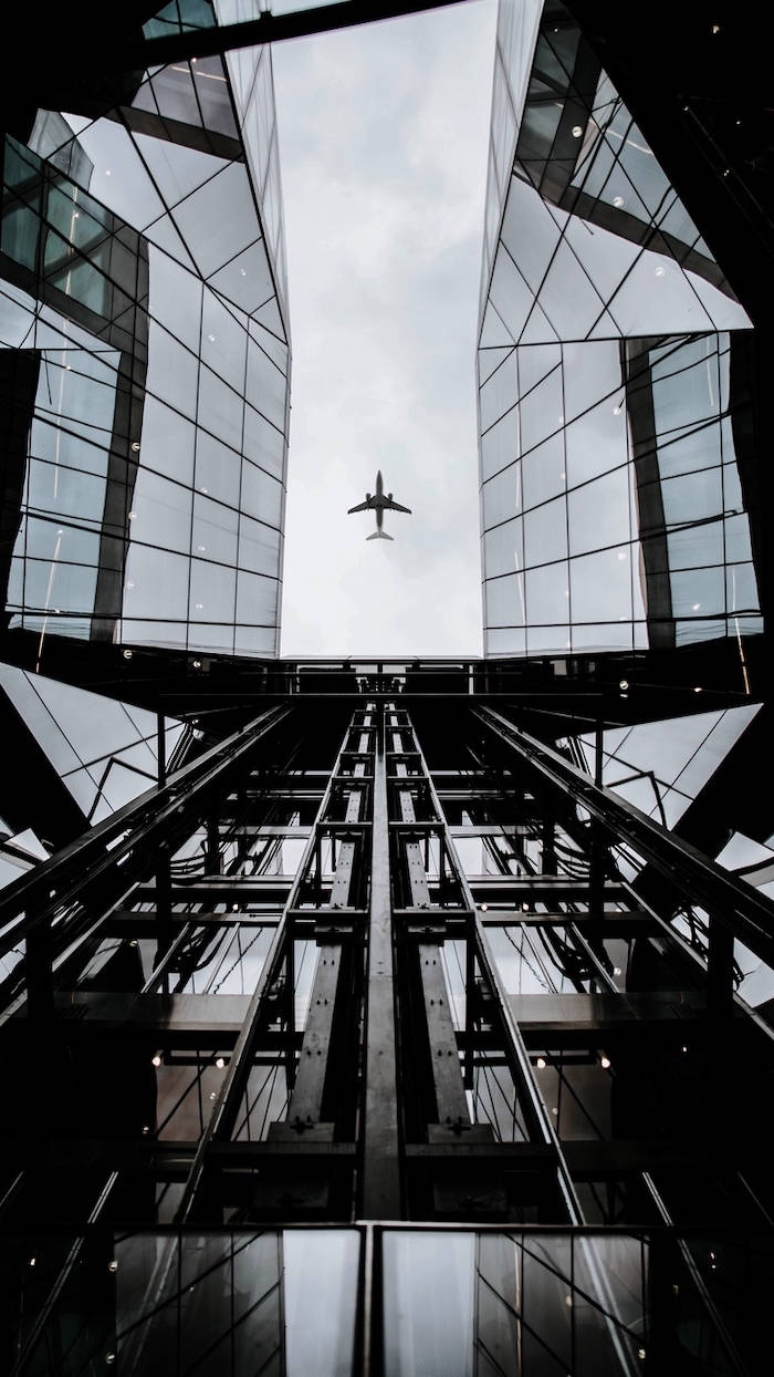 Grayscale Photo Of Glass Buildings Wallpaper