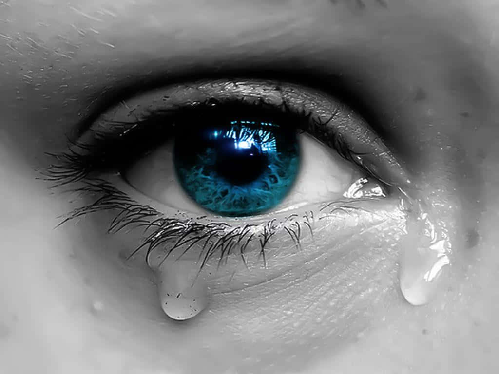 Greyscale Blue Eye Crying With Tears Wallpaper