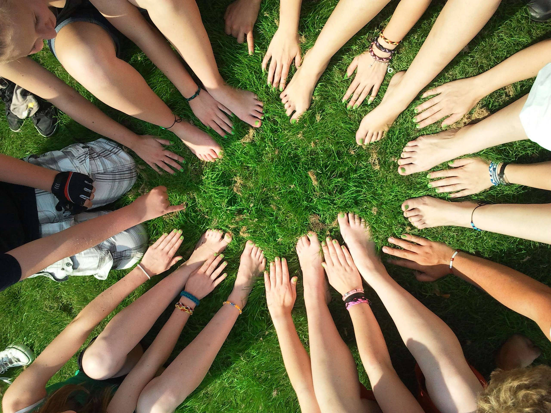 Group Of People In A Huddle Wallpaper