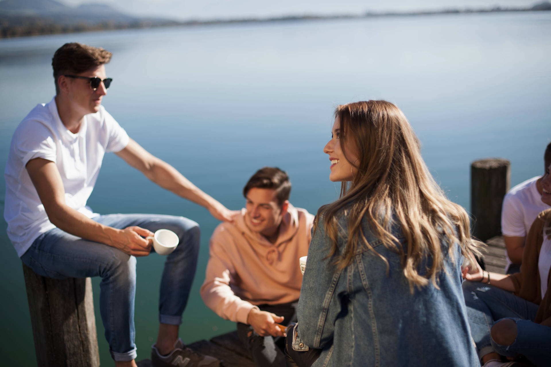 Group Of People On A Dock Wallpaper