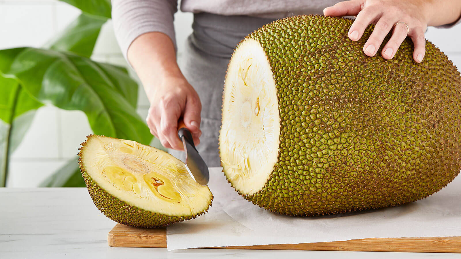 Hand Slicing Ripe Jackfruit Wallpaper