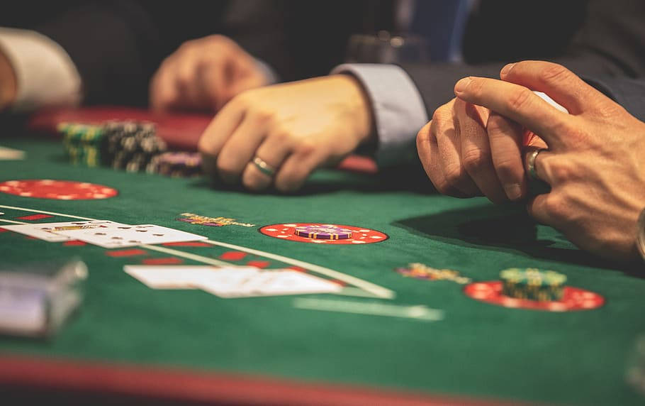 Hands Of Men Wearing Suit Playing Baccarat Wallpaper