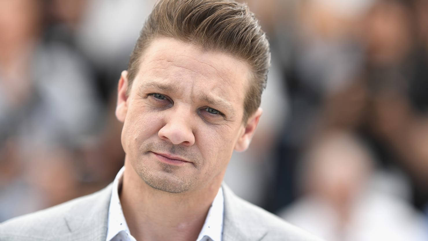 Handsome Jeremy Renner In White Wallpaper