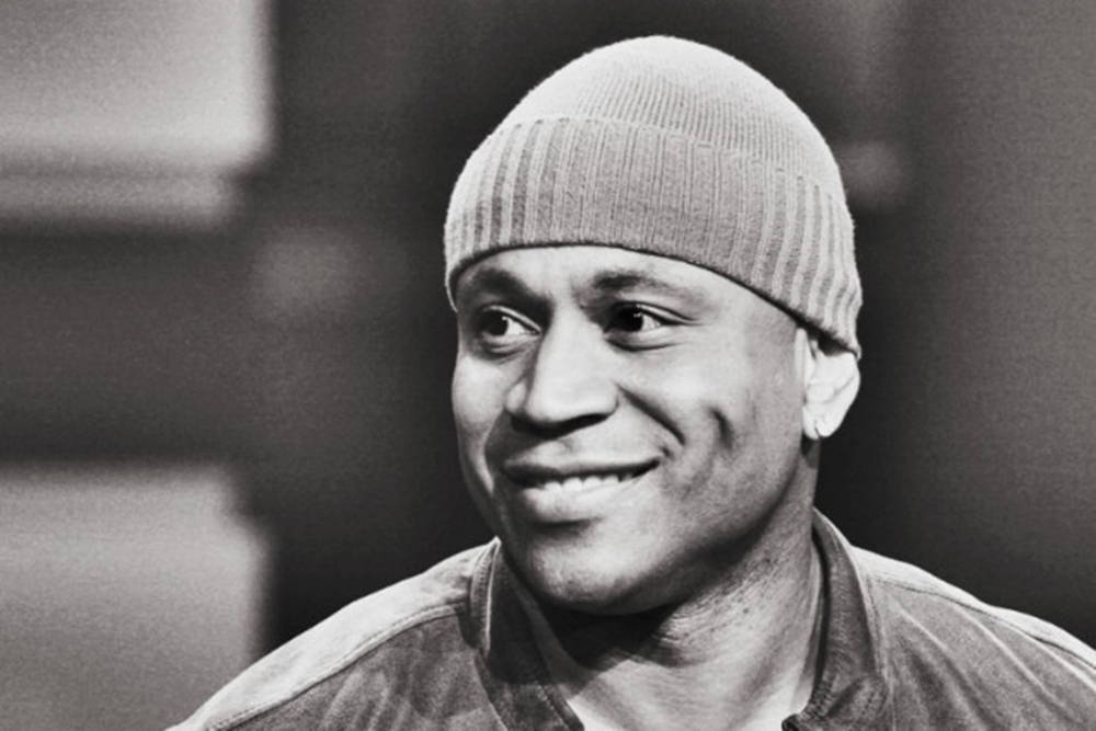 Happy American Rapper Ll Cool J Beanie Wallpaper