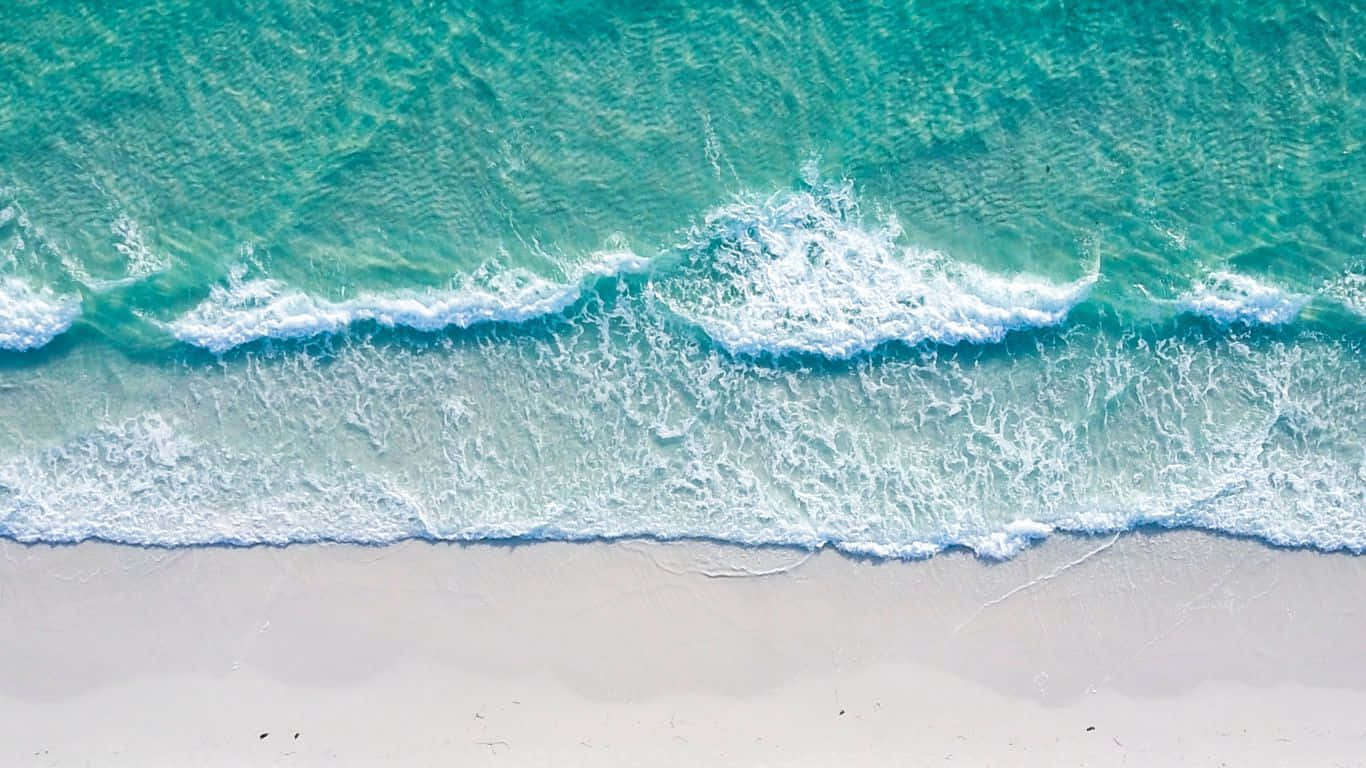 Hd Beach With Foamy Waves Aerial View Wallpaper