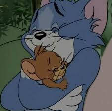 Heart-warming Hug Of Tom And Jerry Aesthetic Wallpaper