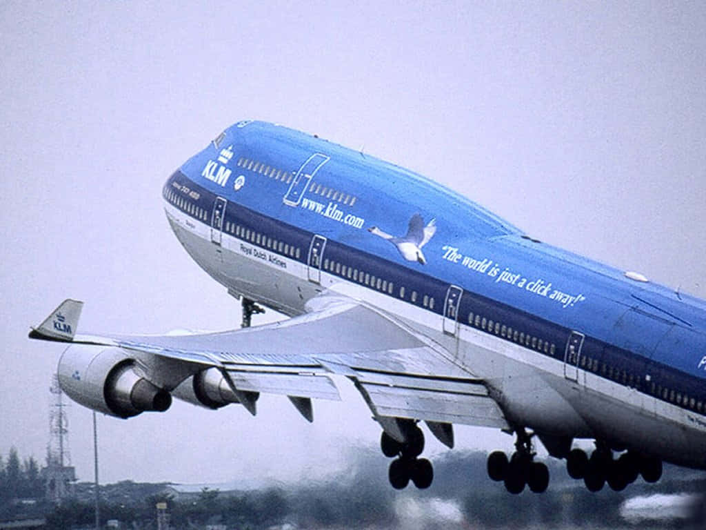 Image Giant Boeing 747 Flying High In Cloudy Sky Wallpaper