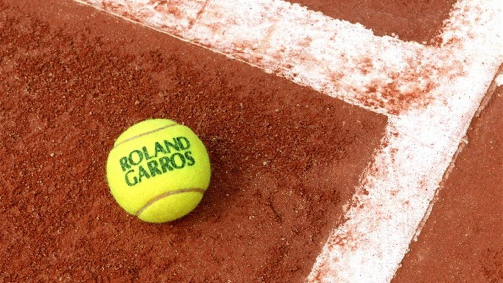 Intense Close-up Of A Tennis Ball At The French Open Wallpaper