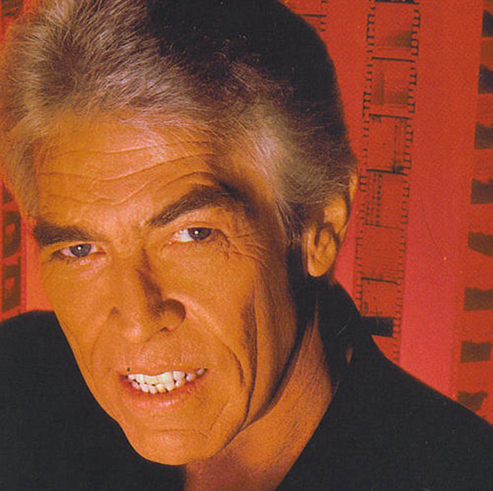 James Coburn Red Background Wallpaper