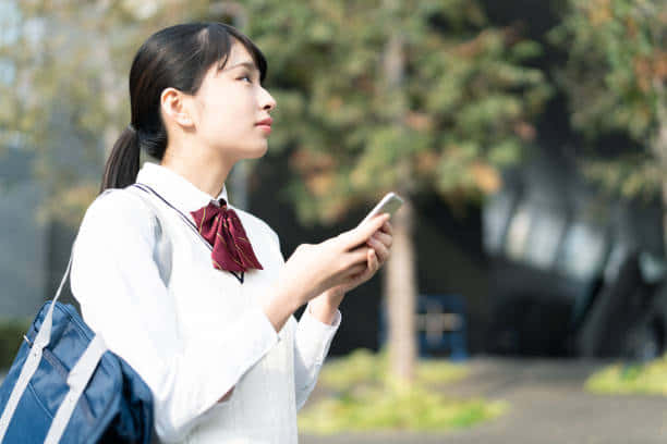 Japanese School Girl In Park Wallpaper