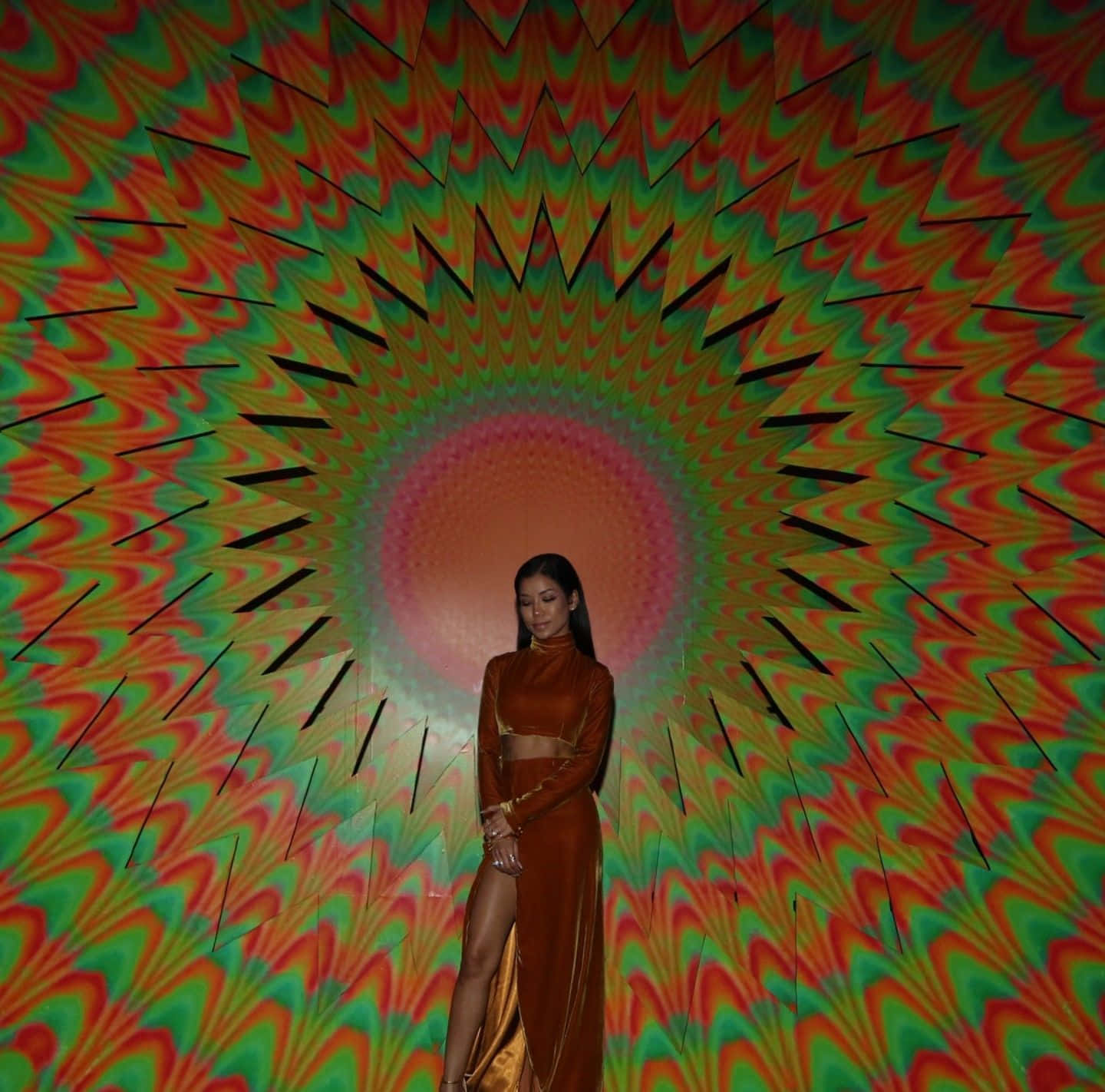 Jhene Aiko Posing Artistically In Colorful Dress Wallpaper