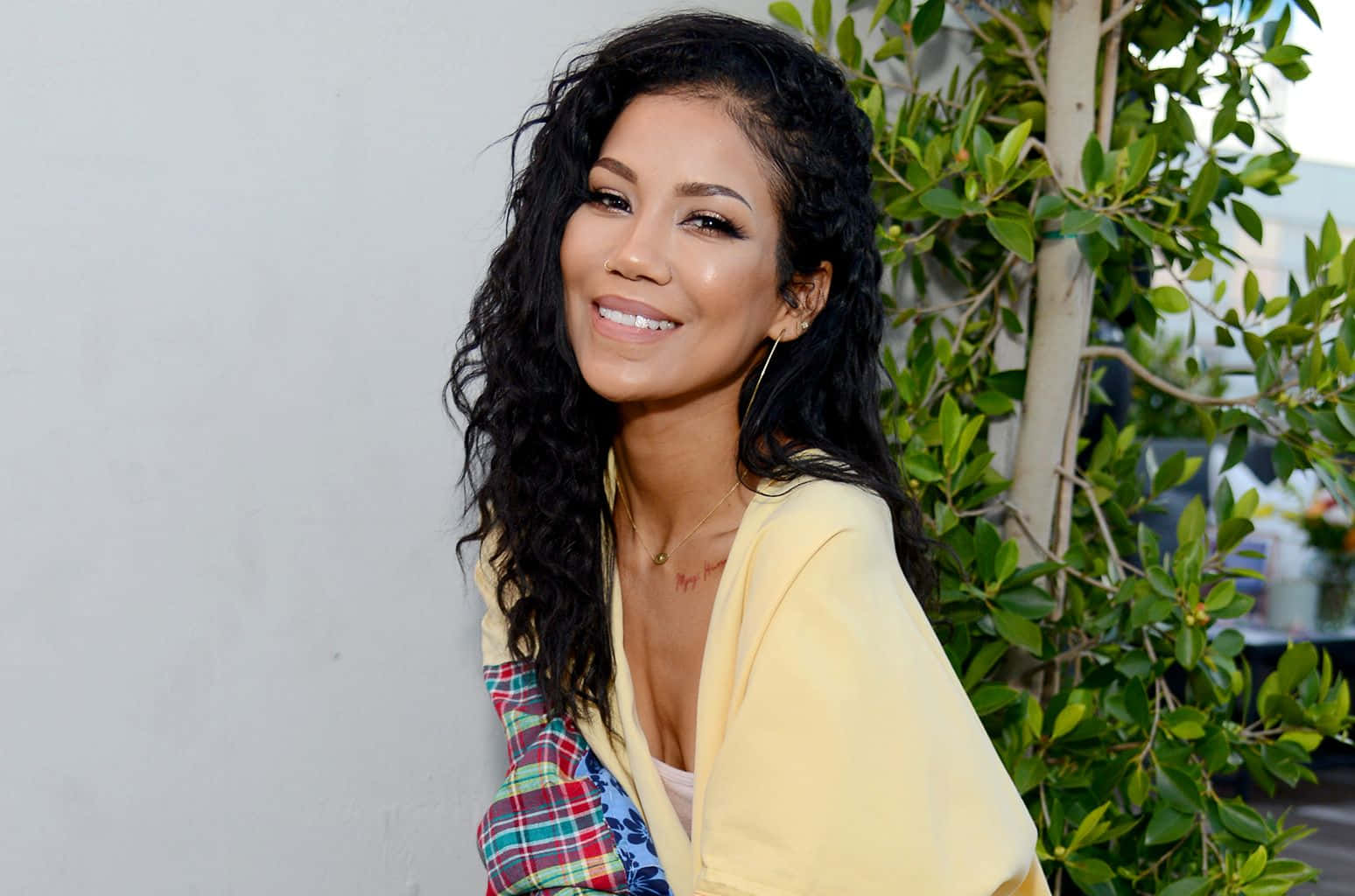 Jhene Aiko Striking A Pose During A Photoshoot Wallpaper