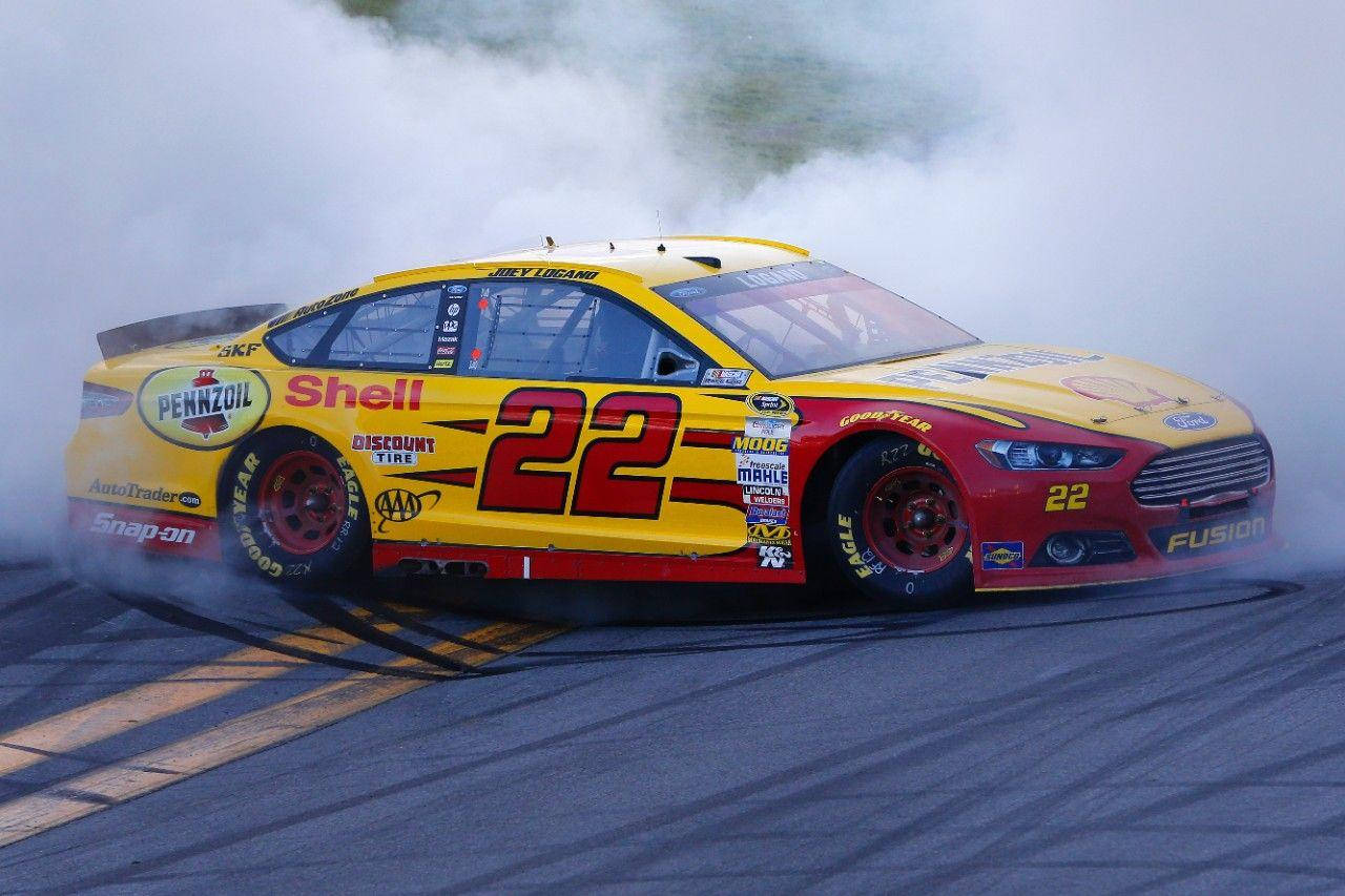 Joey Logano Smoke From Car Wallpaper