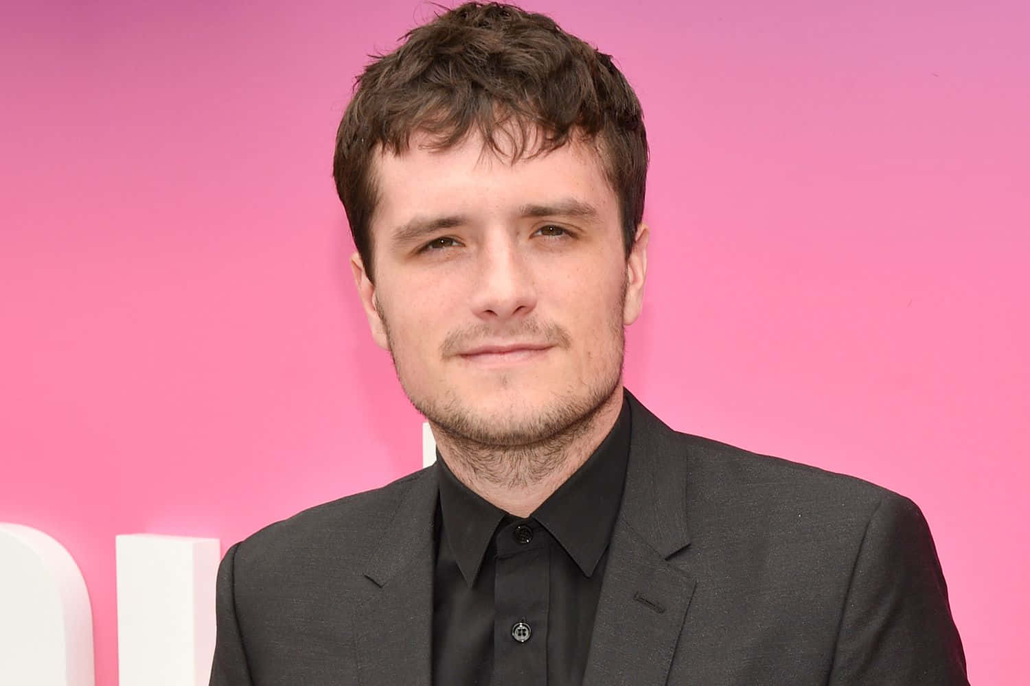 Josh Hutcherson Black Suit Pink Backdrop Wallpaper