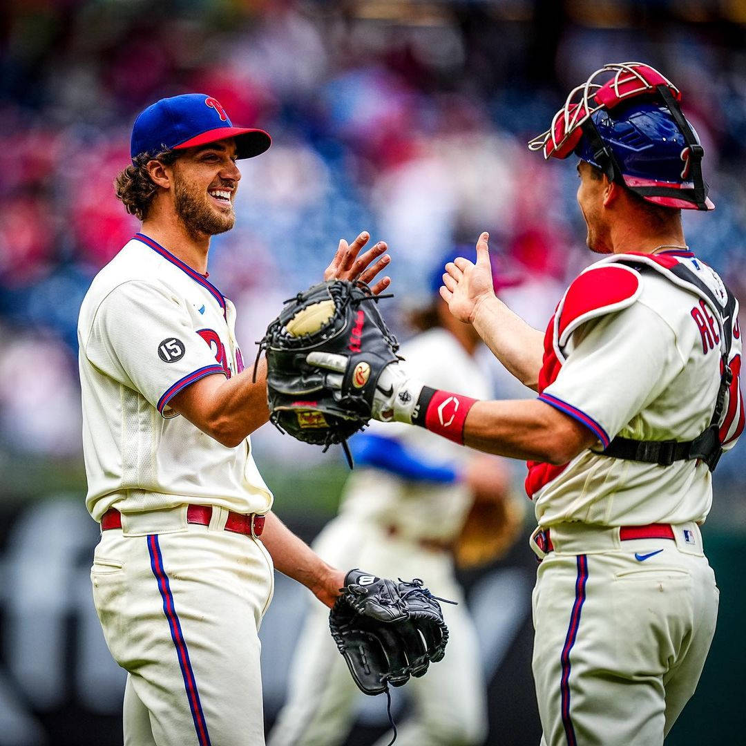 Jt Realmuto High Five With Teammate Wallpaper