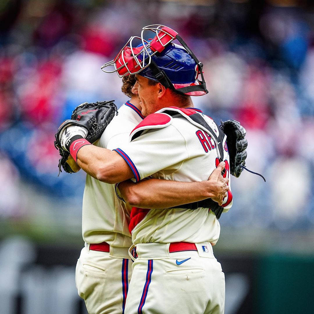 Jt Realmuto Hugging Teammate Wallpaper