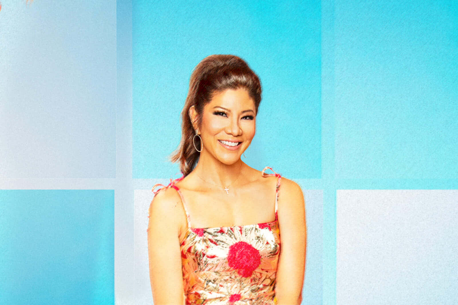 Julie Chen Smiling Against Blue Backdrop Wallpaper