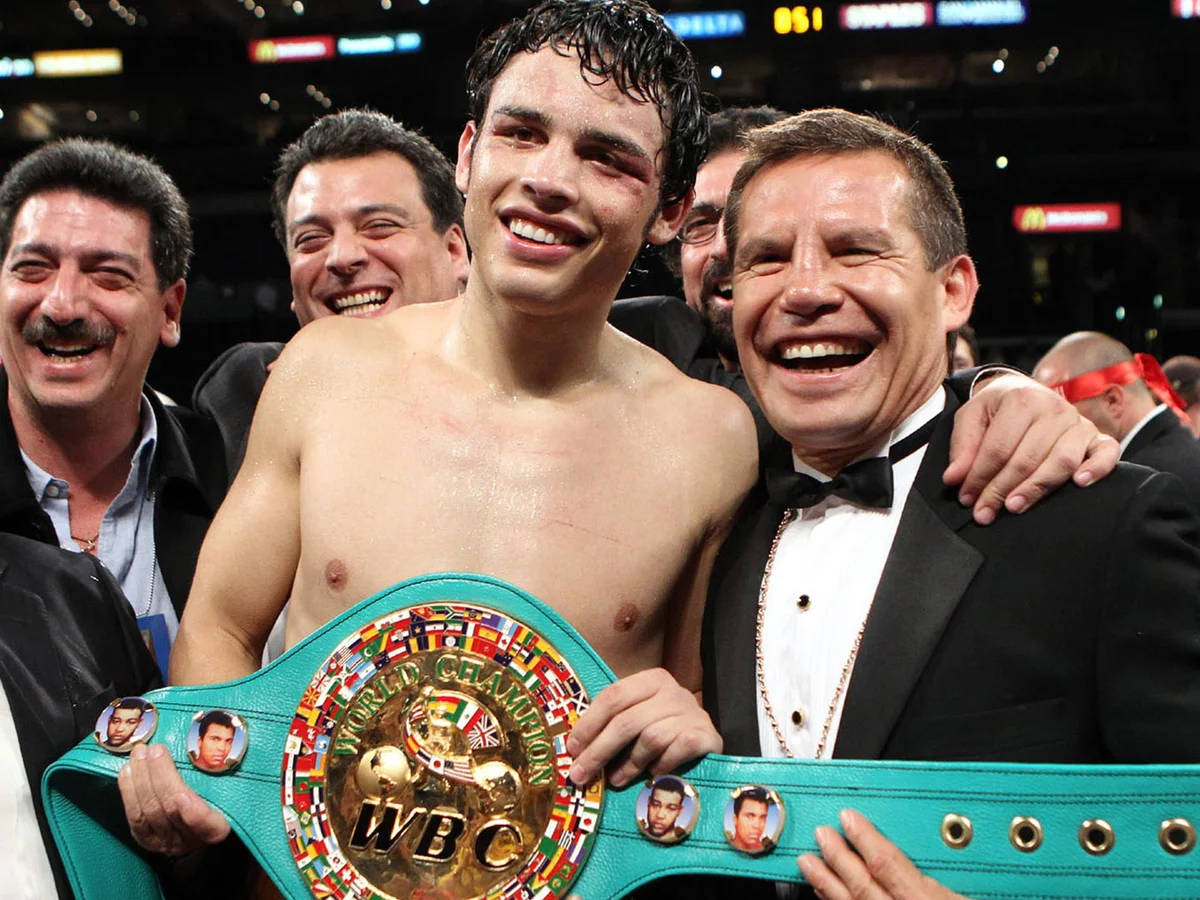 Julio Cesar Chavez With Victorious Son Wallpaper