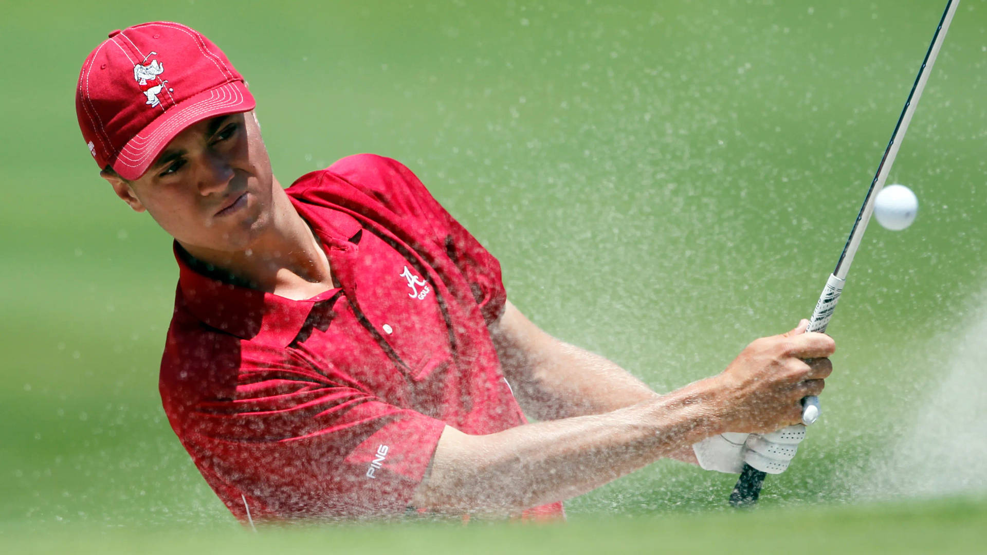 Justin Thomas In Red Golf Gear Wallpaper