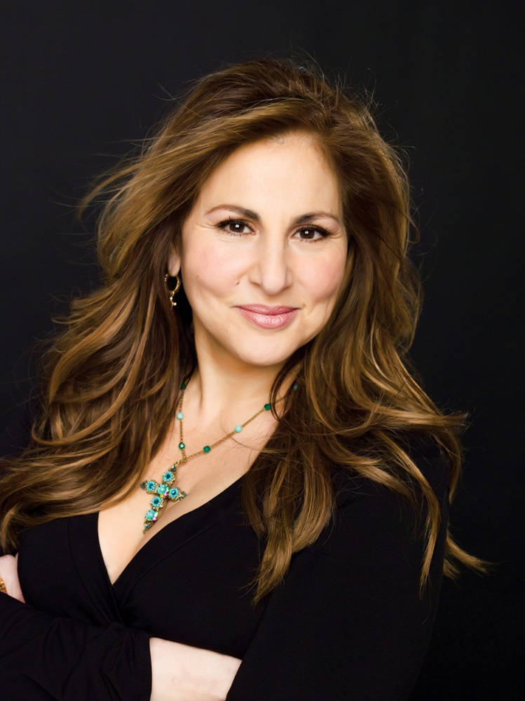 Kathy Najimy Posing Elegantly In Classy Black Outfit Wallpaper