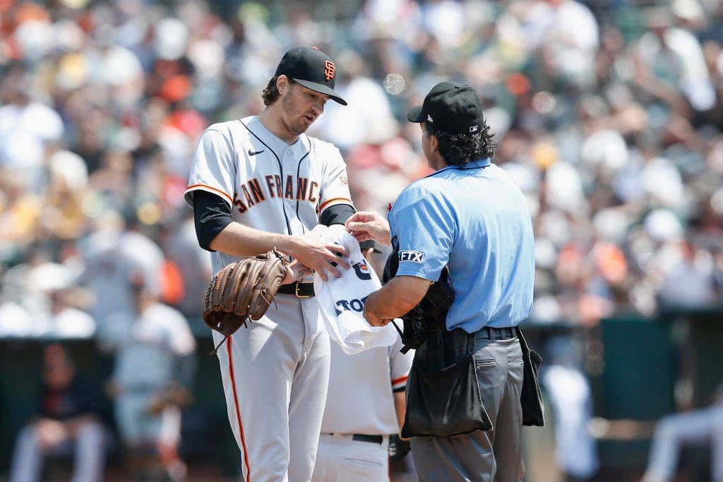 Kevin Gausman Covering White Towel On His Left Arm Wallpaper