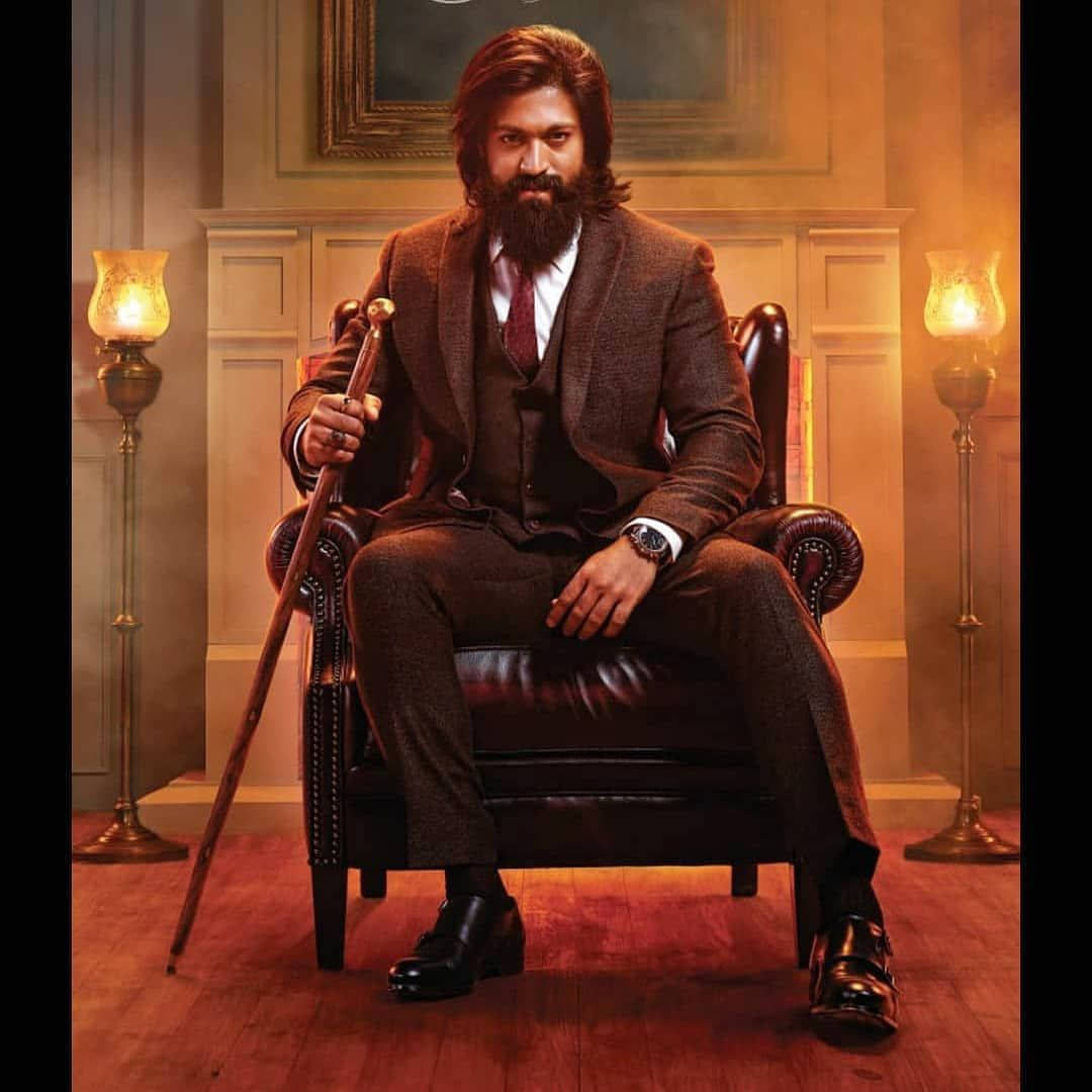 Kgf Rocky Bhai On Chair Wallpaper