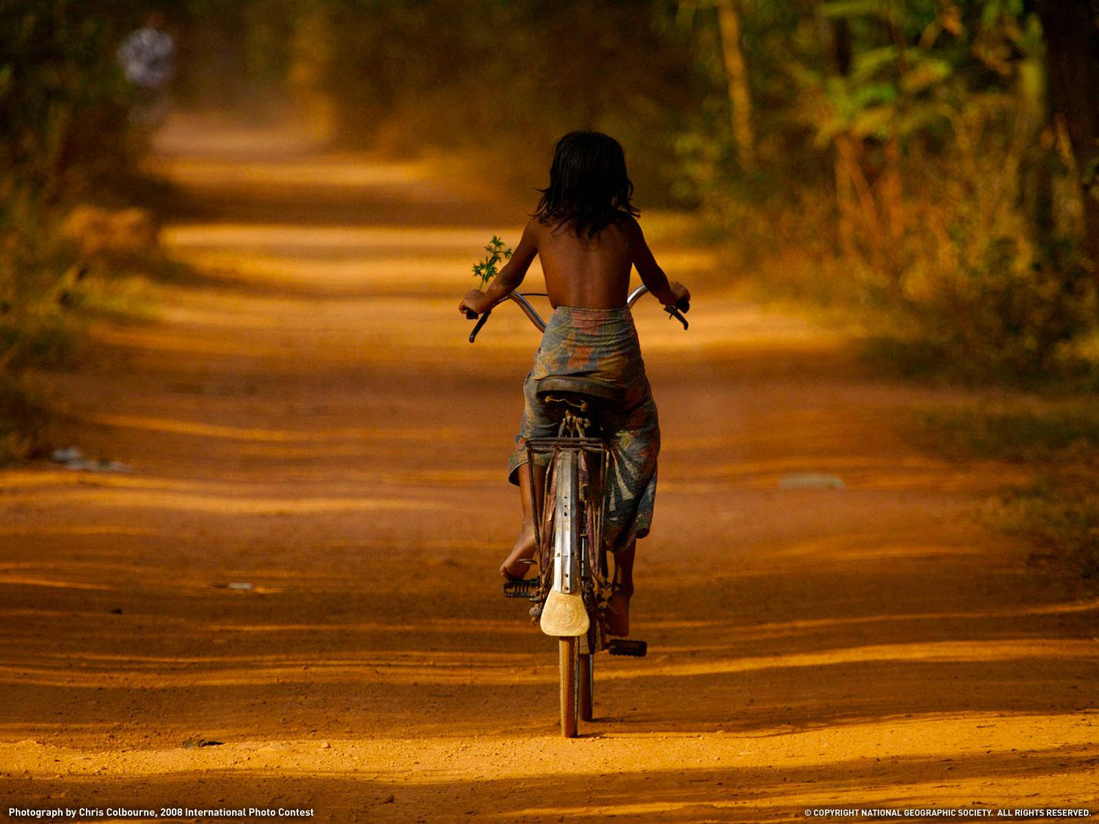 Kid Doing Bike Ride Wallpaper