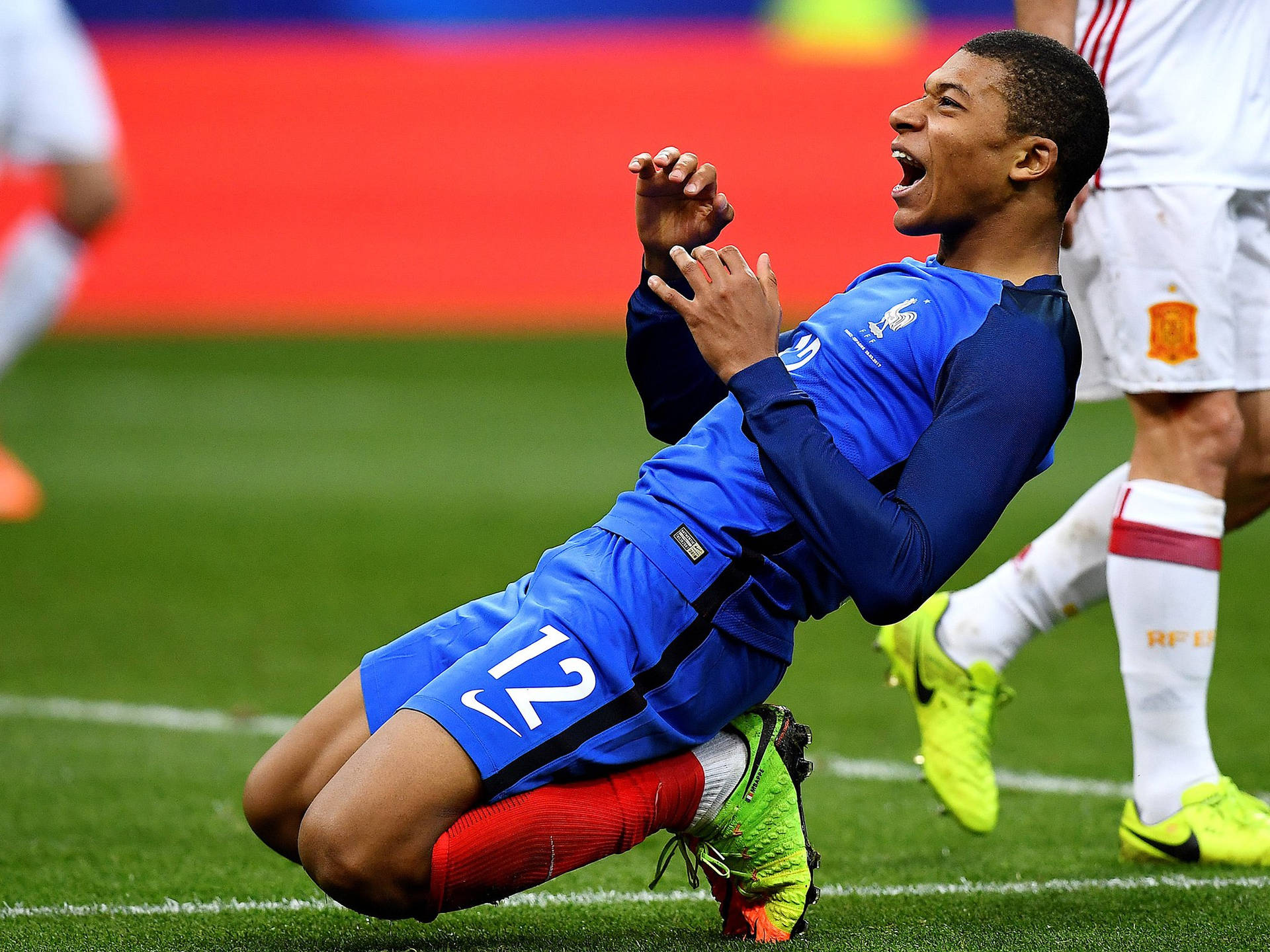 Kylian Mbappe Kneeling As Celebration Wallpaper | WallpapersOK