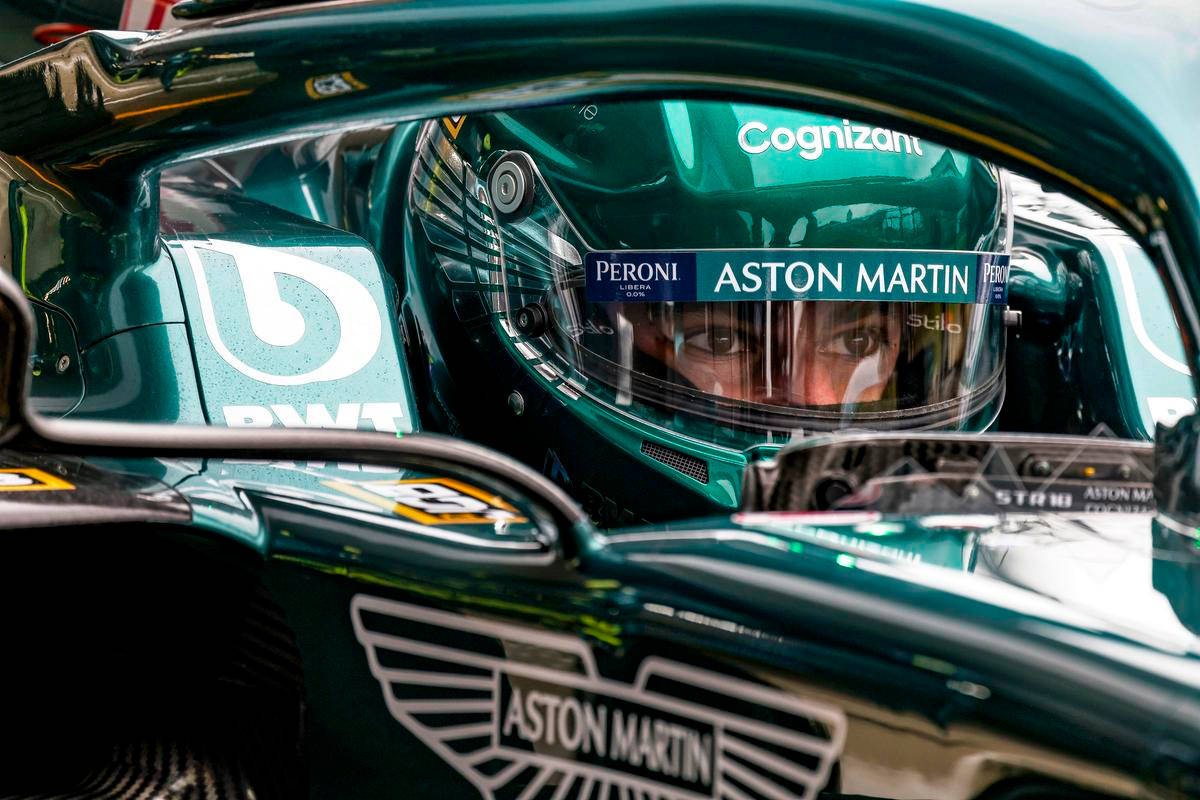 Lance Stroll Aston Martin Car And Helmet Wallpaper