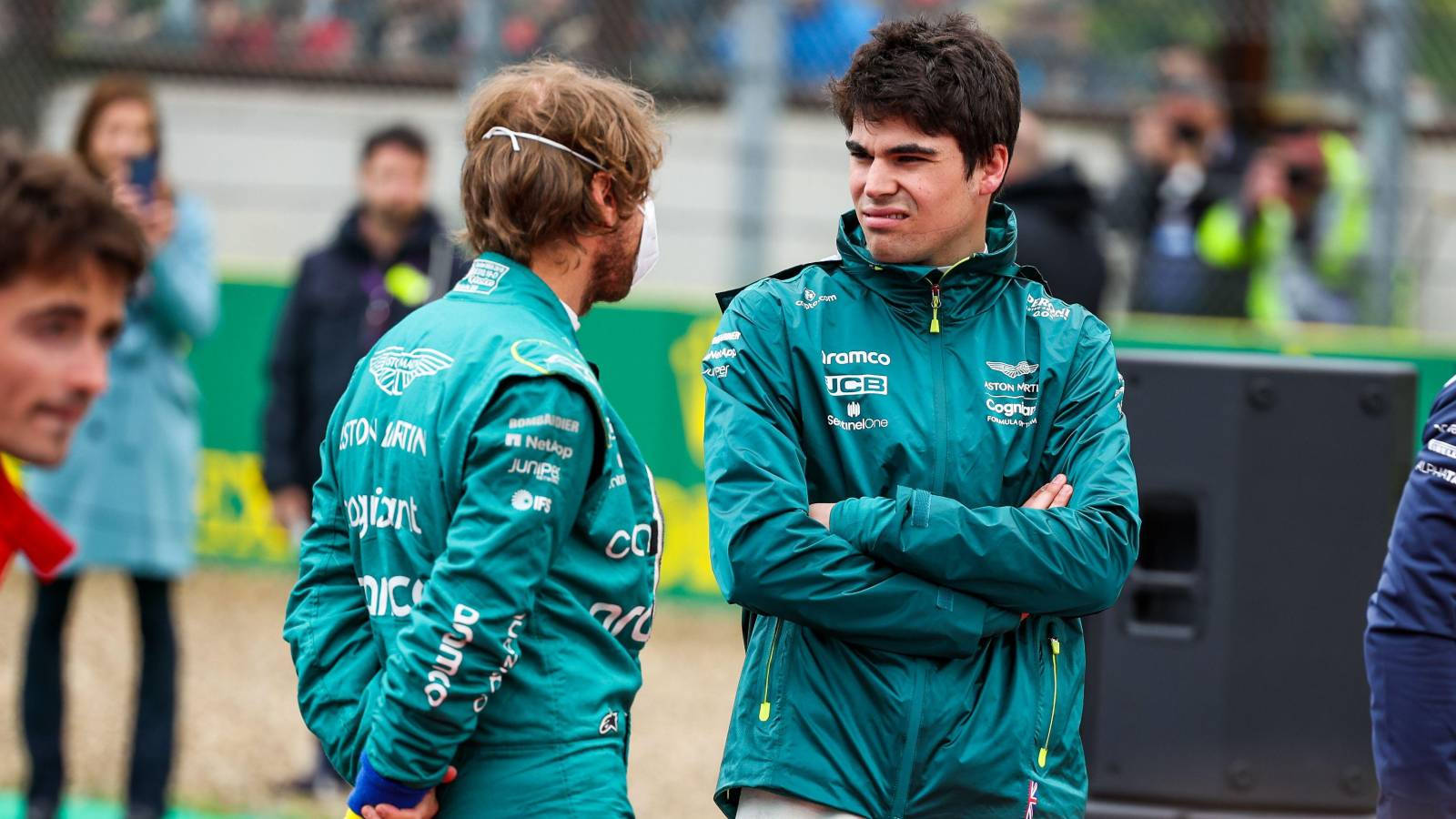 Lance Stroll Talking To Teammate Wallpaper