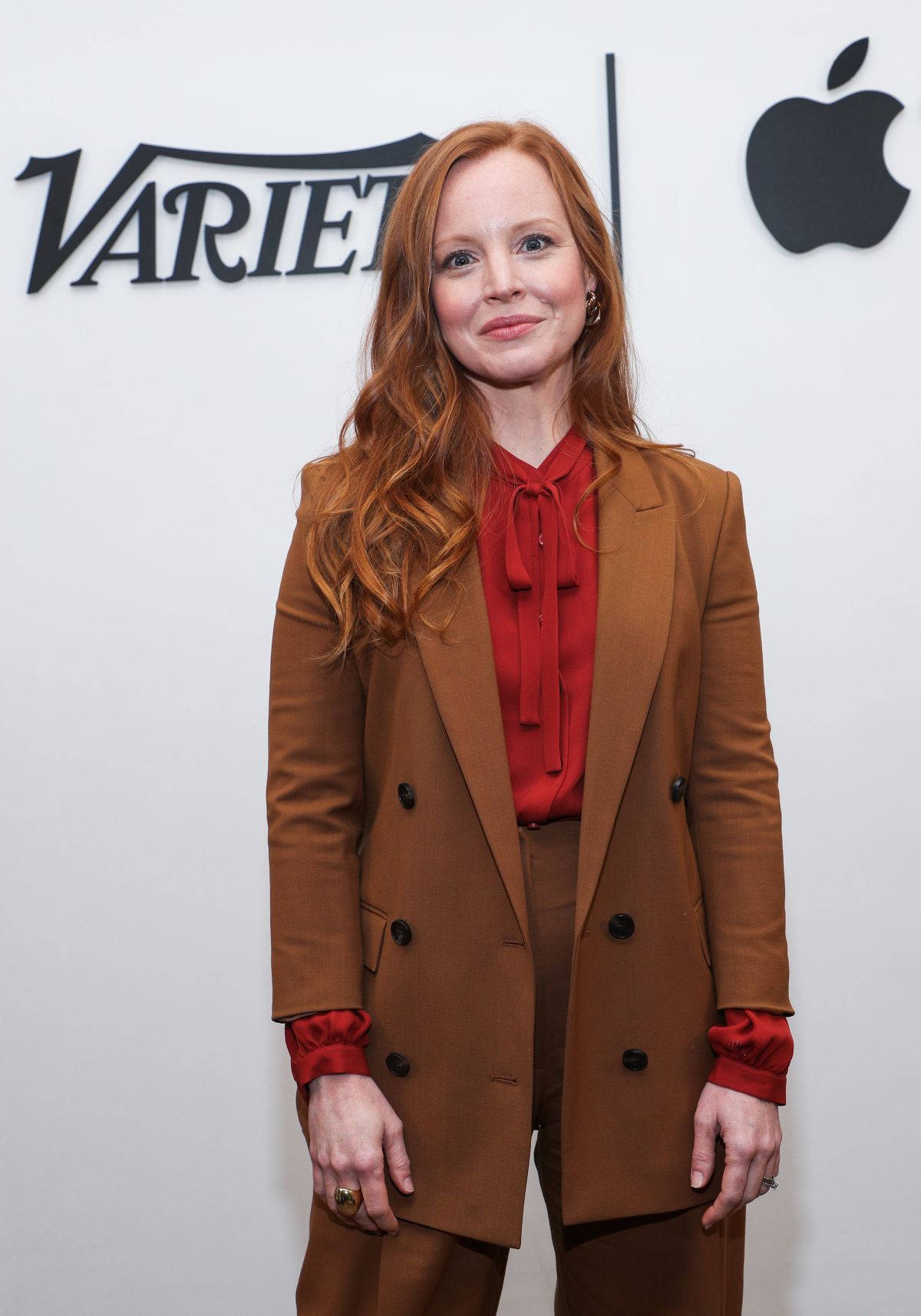 Lauren Ambrose In A Brown Suit Wallpaper