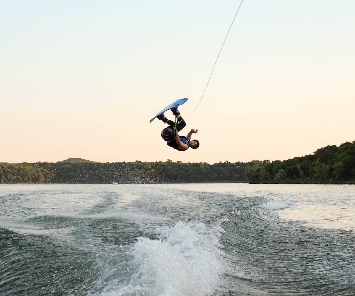 Leap Of Passion: A Wakeboarder Mid-air In Action. Wallpaper