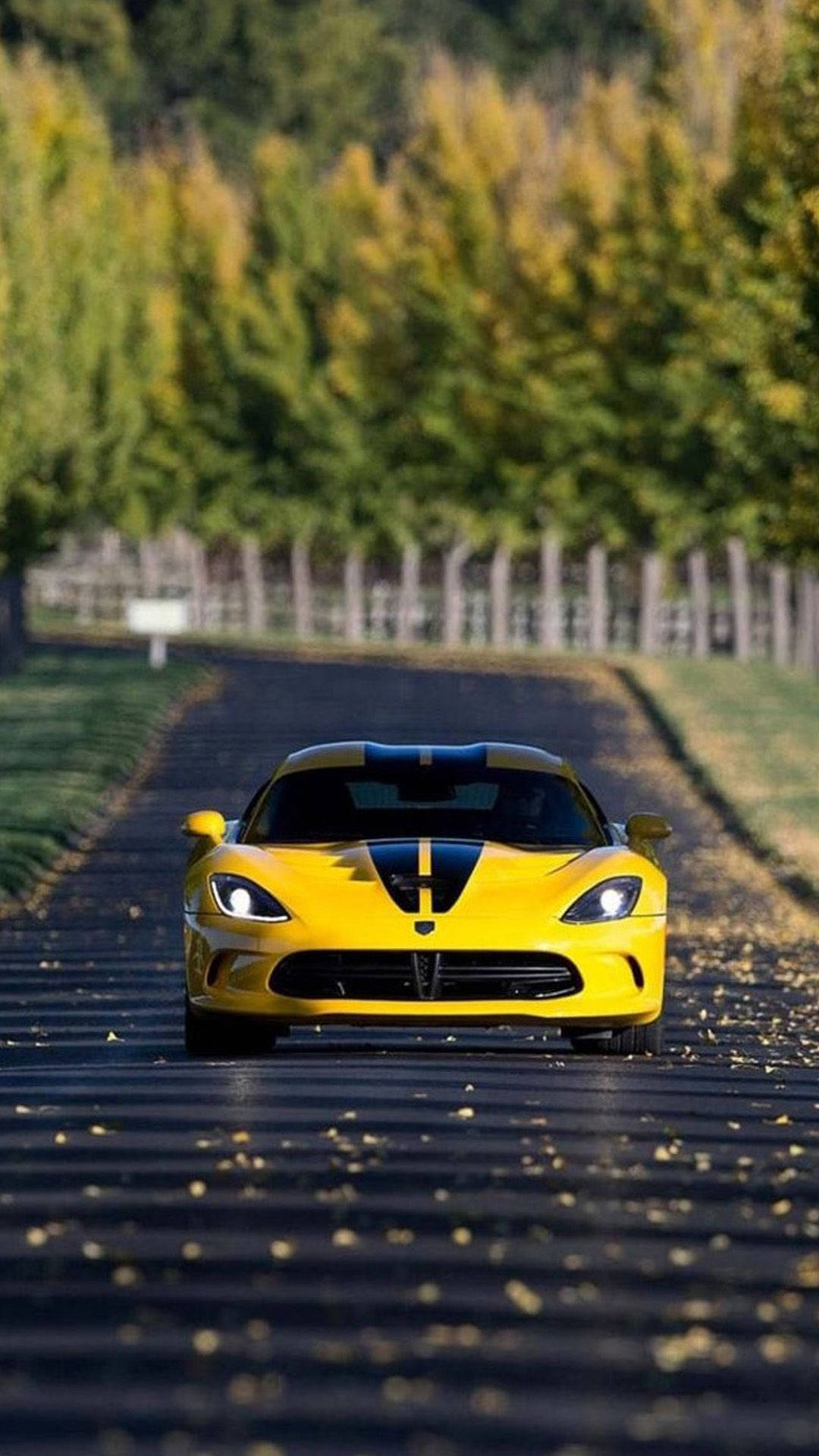 Leaves And Yellow Sports Car Iphone Wallpaper
