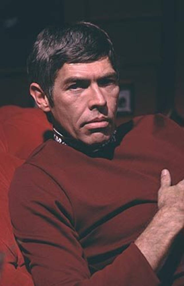 Legendary American Actor, James Coburn In Red Shirt Wallpaper