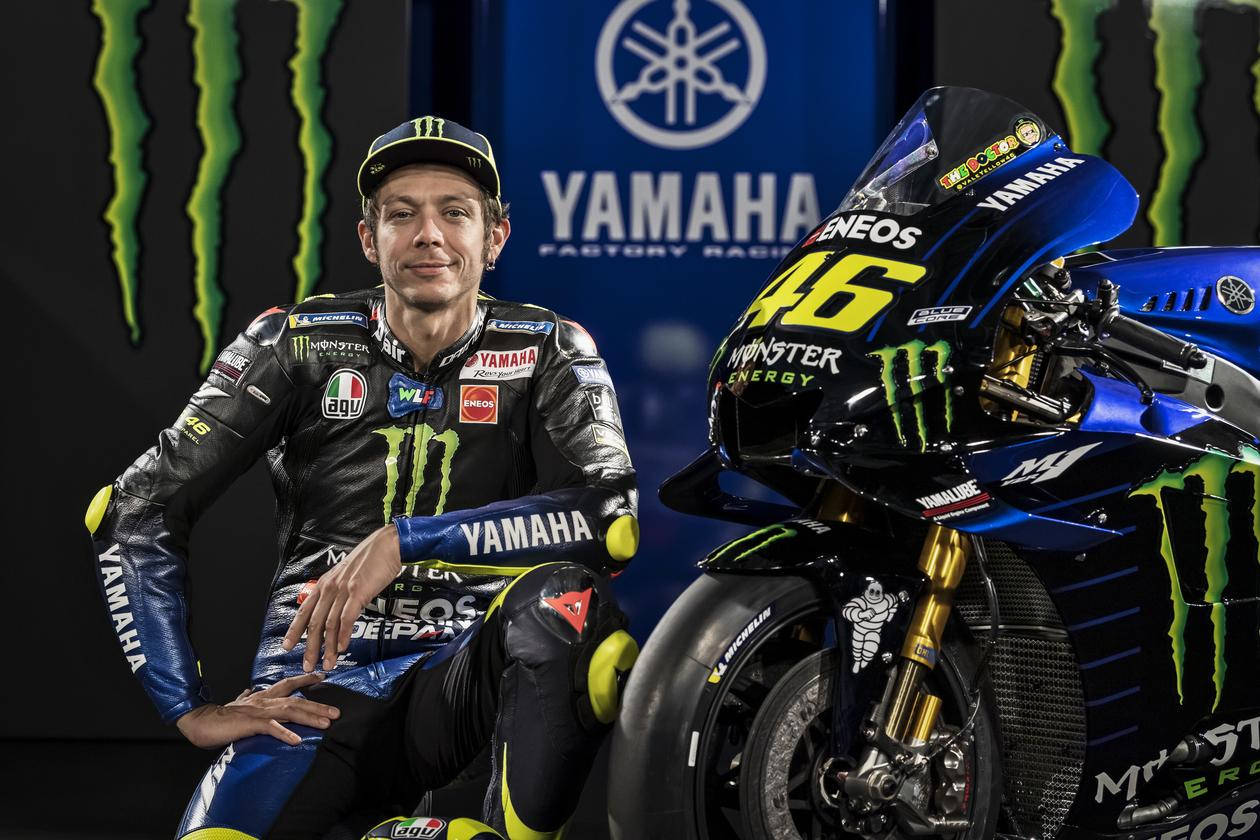 Legendary Motogp Driver Valentino Rossi Riding His Yamaha Motorcycle Wallpaper