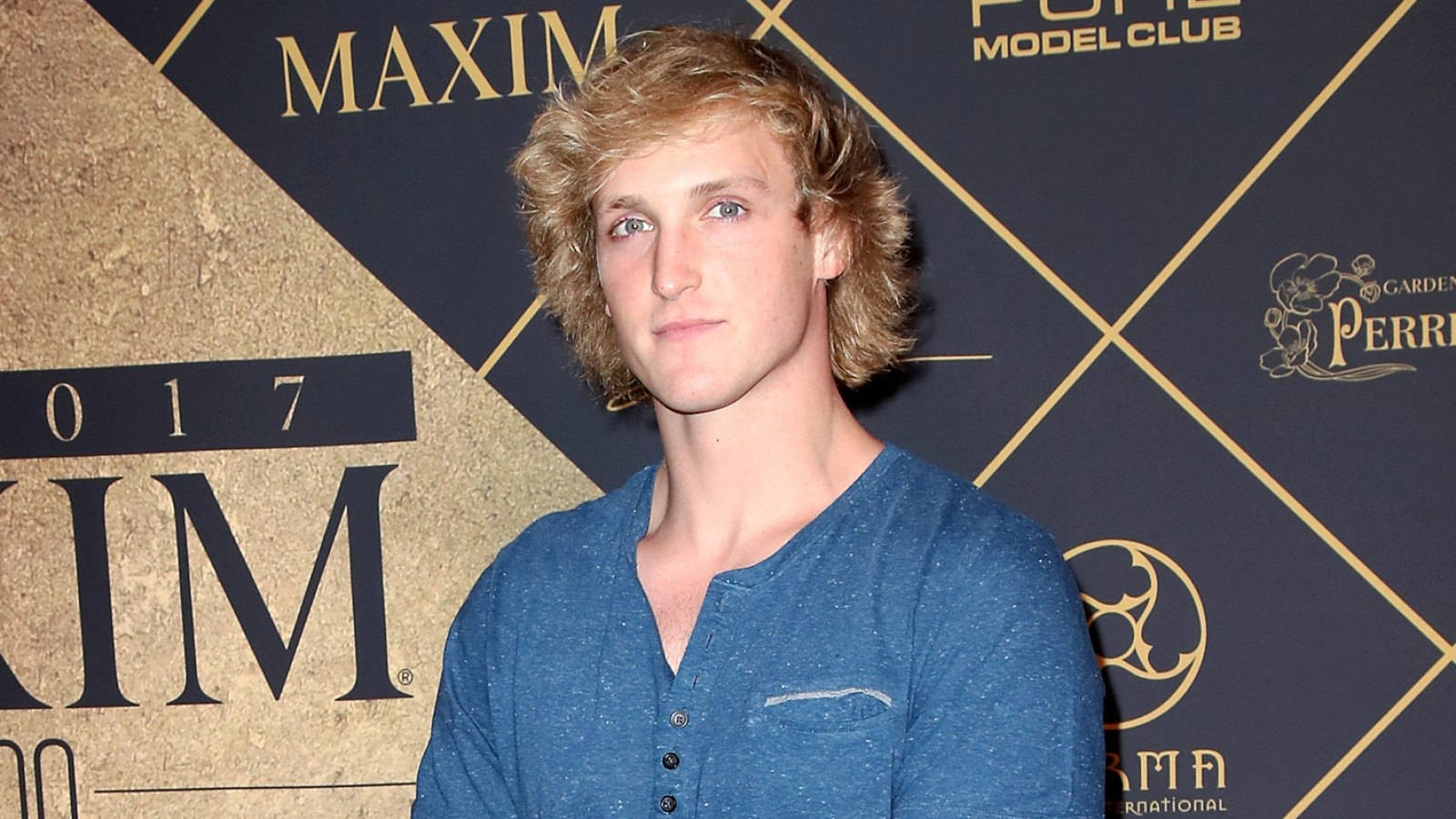 Logan Paul On His Blue Shirt Wallpaper