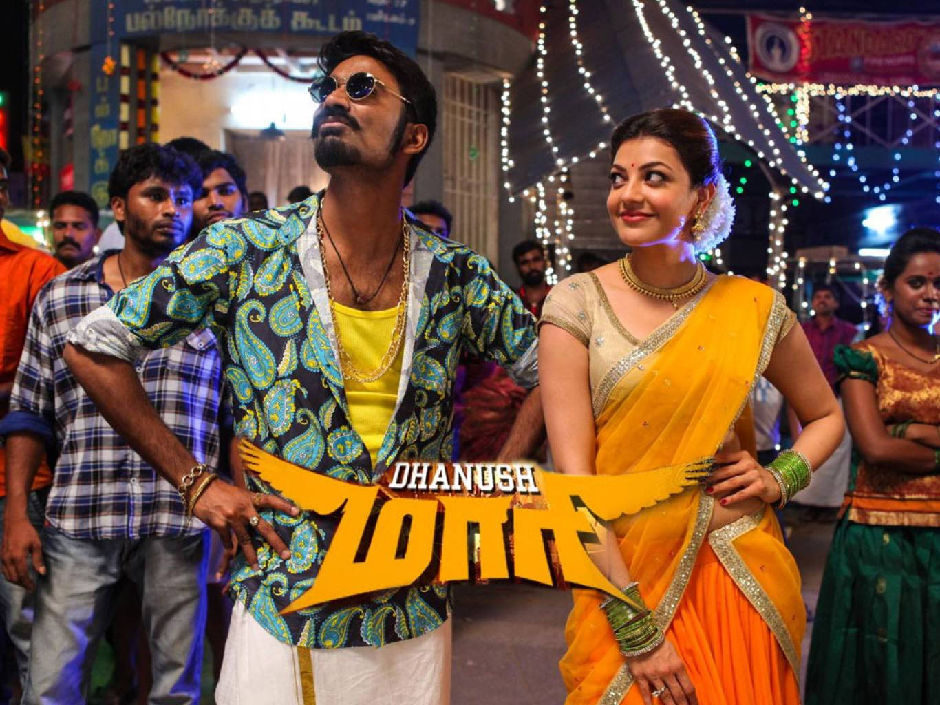 Maari And A Stunning Woman Wallpaper