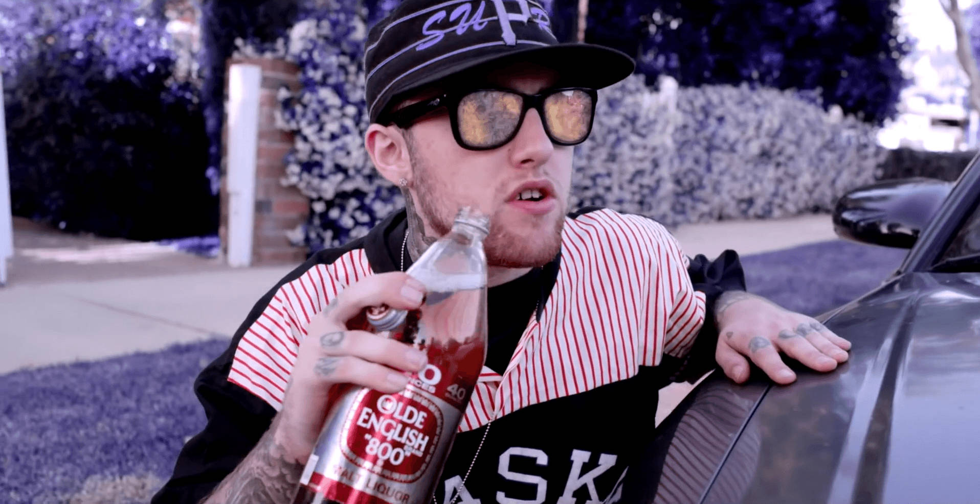 Mac Miller Holding Bottle Wallpaper