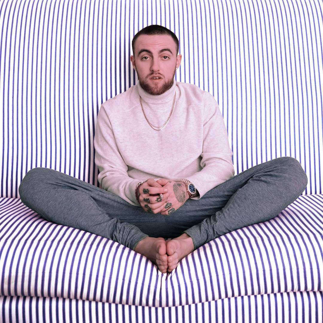 Mac Miller On Striped Sofa Wallpaper