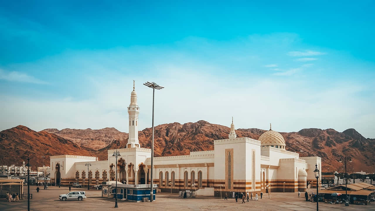 Madina Mosque Against Mountain Backdrop Wallpaper