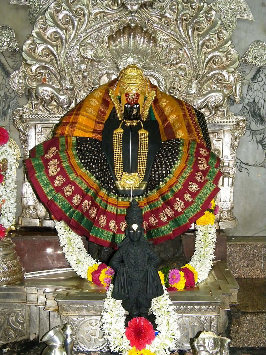 Mahalakshmi Statue Adornedin Temple Wallpaper