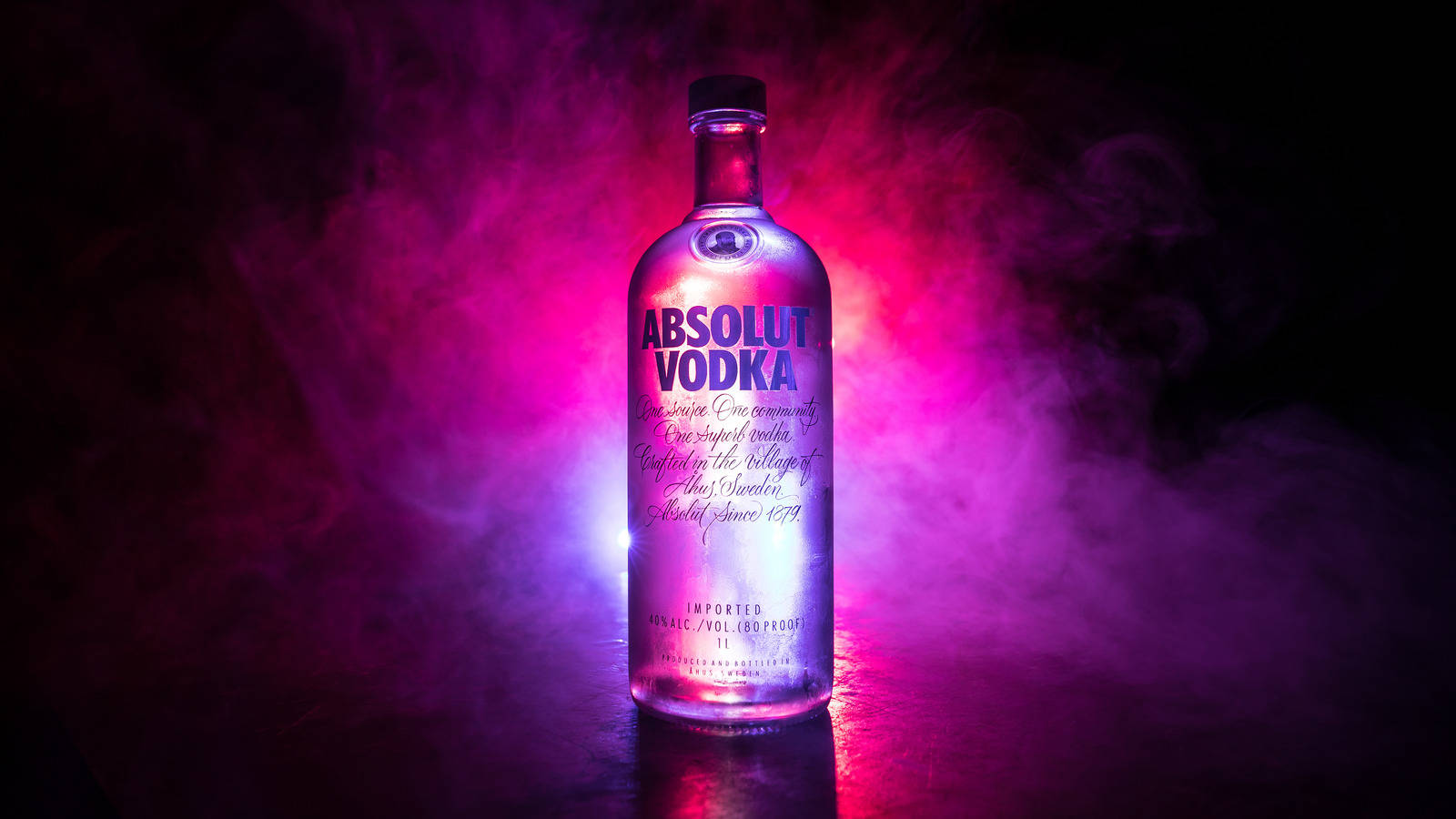 Majestic Absolut Vodka Bottle Amidst Purple Smoke Wallpaper