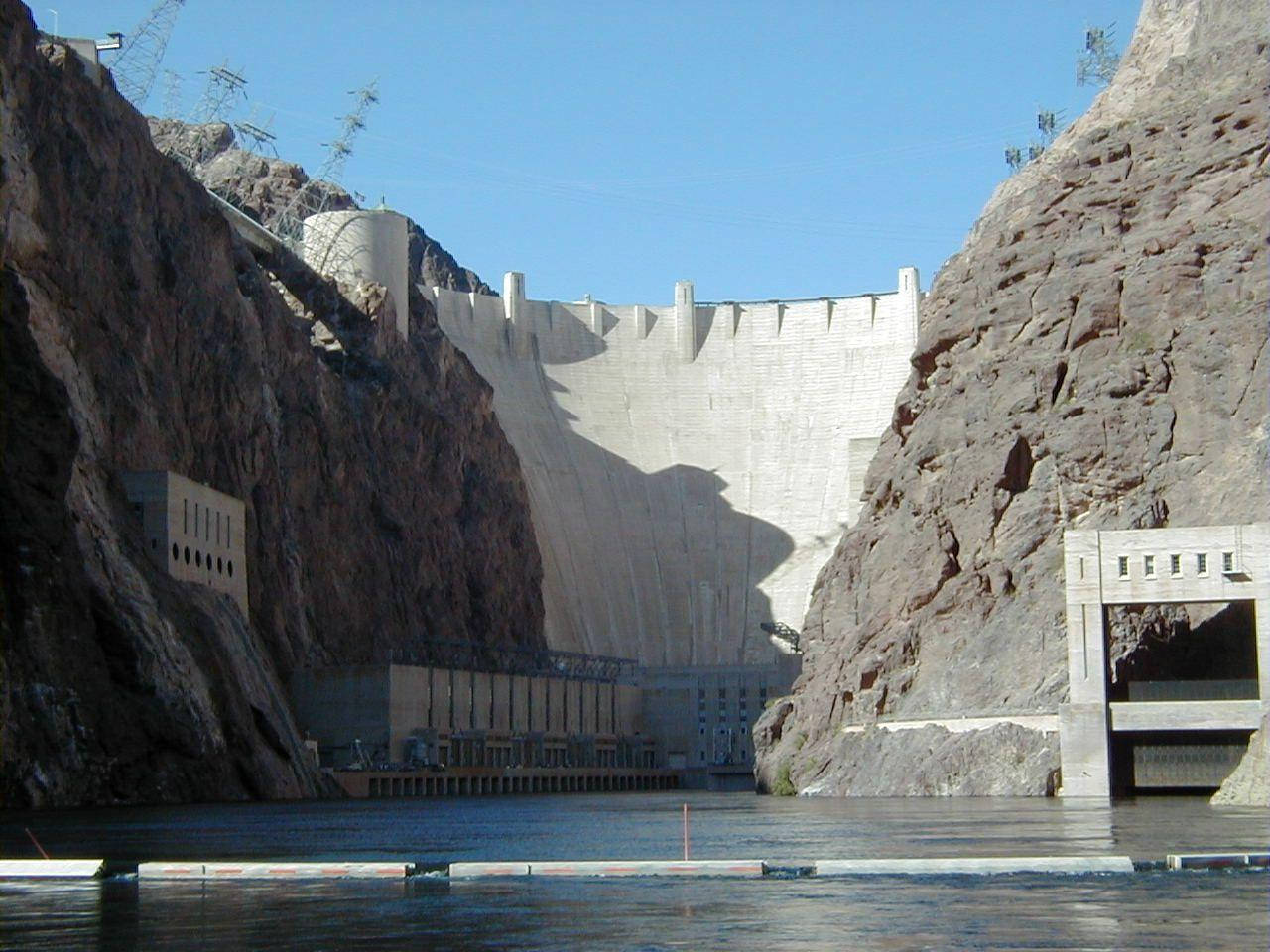 Majestic Hoover Dam Beautifully Viewed At Sunset. Wallpaper